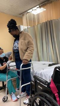 Patient Sheneque Hanse during physical therapy